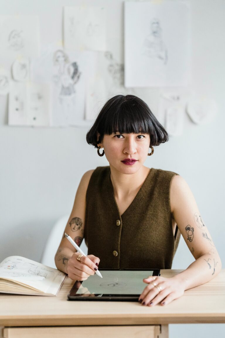 Woman writing about and designing her artist brand